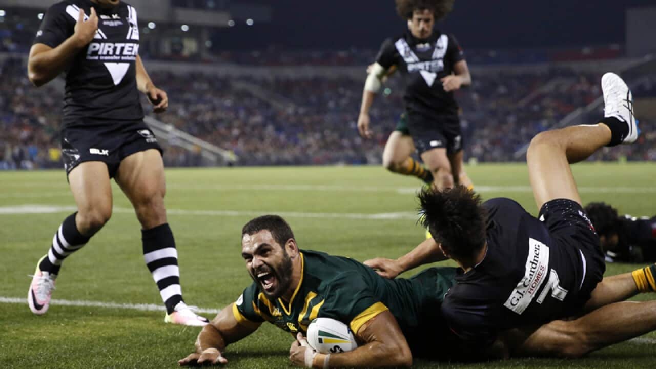 Australia's Greg Inglis scores a try during a Test match