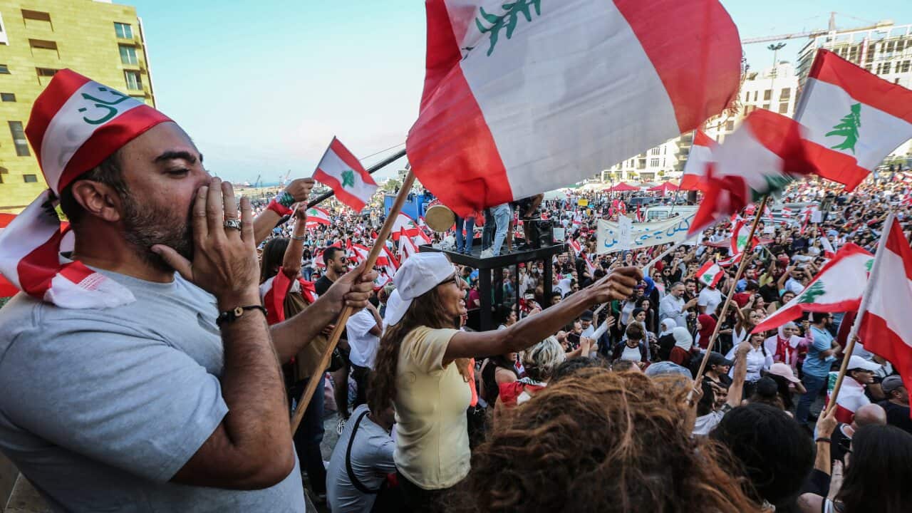 Protesters attend a demonstration against government in front of Muhammad al-Amin Mosque in downtown Beirut, Lebanon.