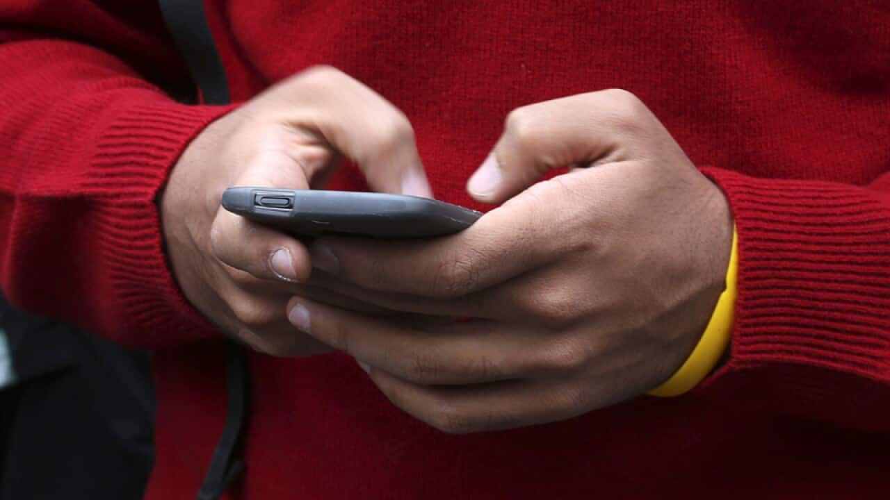 A person uses a mobile phone