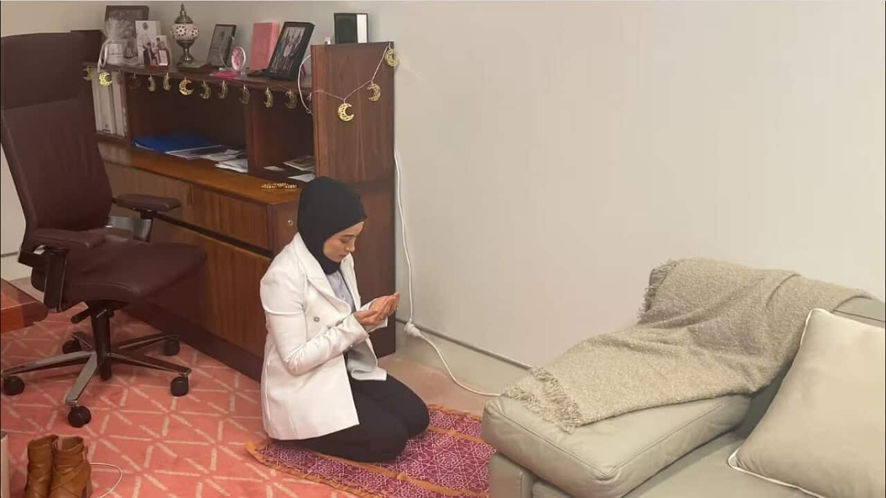 Senator Payman performs her sunset prayer after breaking her fast. (SBS News).jpg