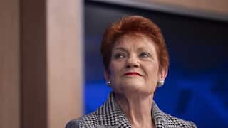 Pauline Hanson in a black and white jacket.