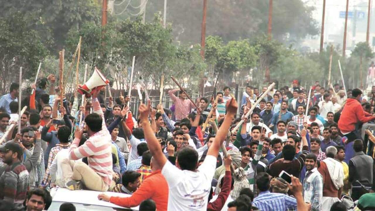 Jat protesters brandishing sticks in Haryana