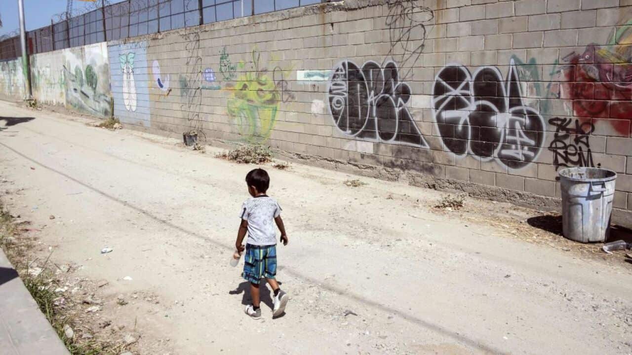 A migrant boy at the US-Mexico border.
