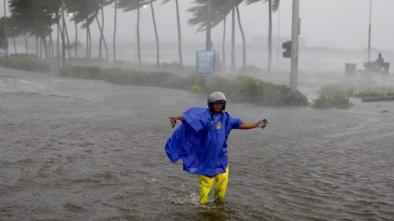 A traffic officer in the Philippines during the typhoon