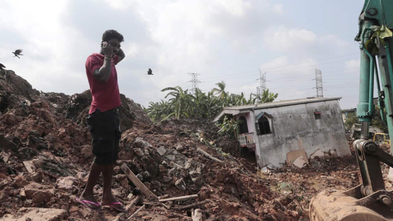 A Sri Lankan man at the scene of a collapsed rubbish tip