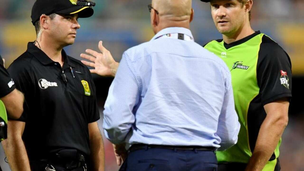 Sydney Thunder's Shane Watson (R) talking to match officials
