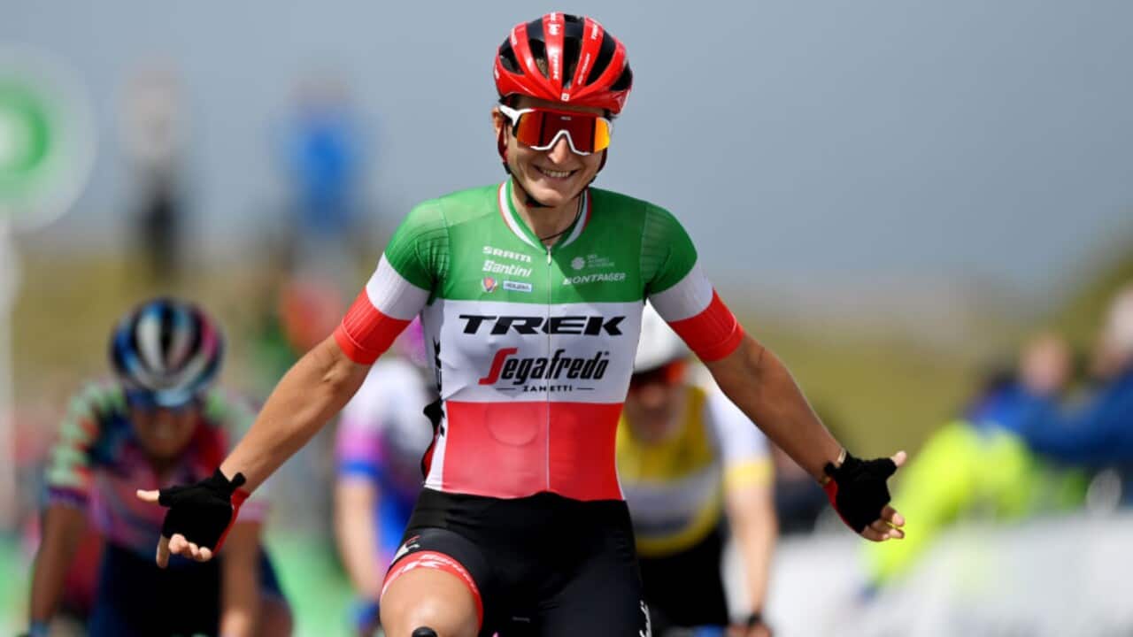 Elisa Longo Borghini celebrates as she crosses the finish line