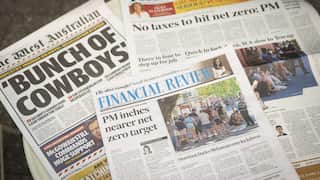 Three newspaper stacked on top of each other