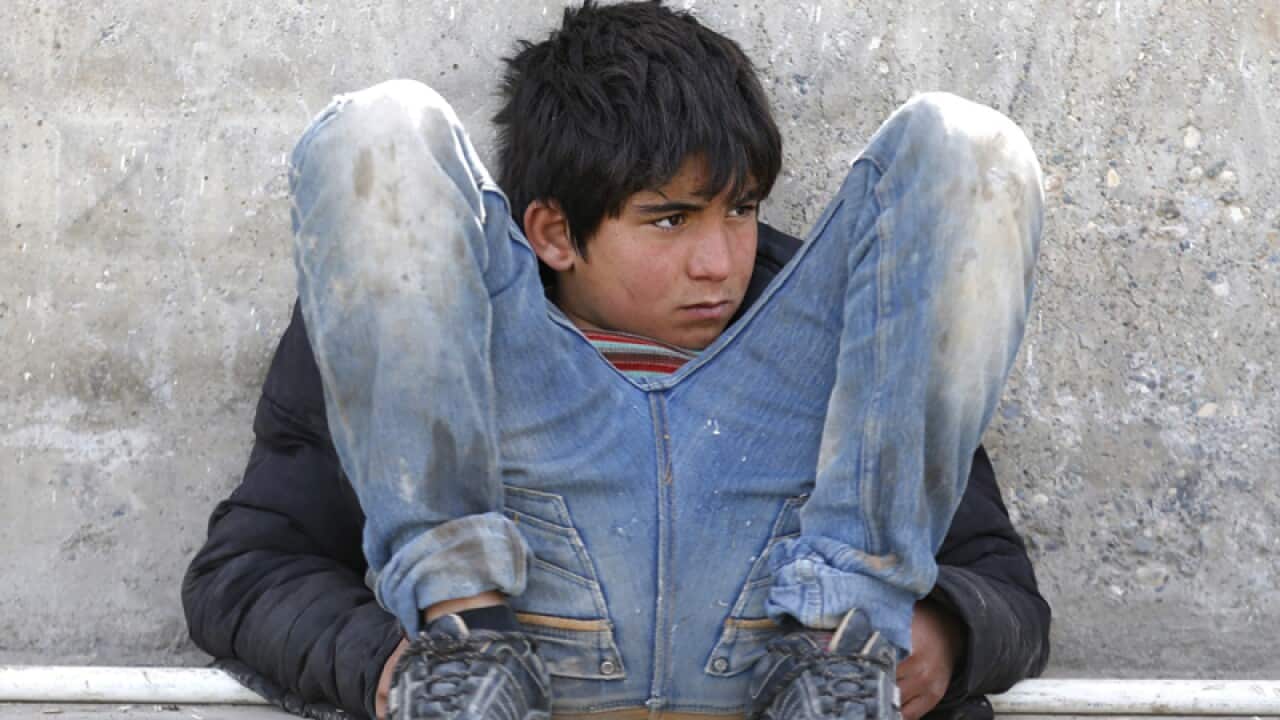 A Syrian refugee boy near Oncupinar border gate in Kilis city, Turkey