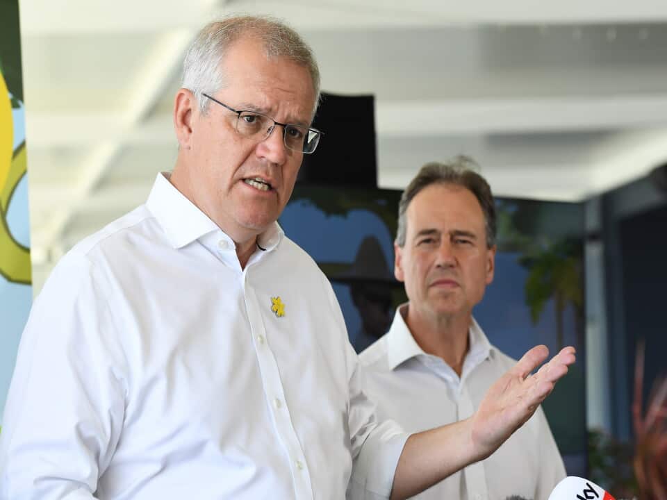 Prime Minister Scott Morrison speaks to the media during a community breakfast on Bribie Island, north of Brisbane, Tuesday, December 21, 2021. (AAP Image/Albert Perez) NO ARCHIVING