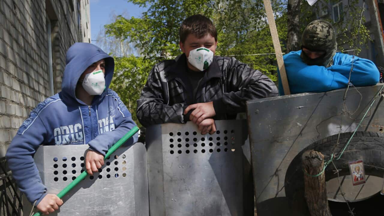 Pro-Russian protesters guard barricades
