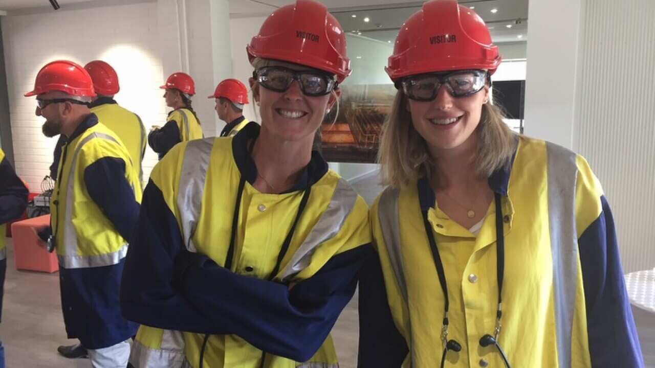 Rachael Lynch, left, and Ellyse Perry prepare to tour the Port Kembla Steelworks