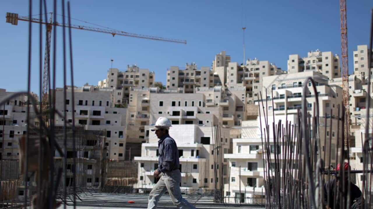 A construction worker at a site of a new housing unit in Jerusalem