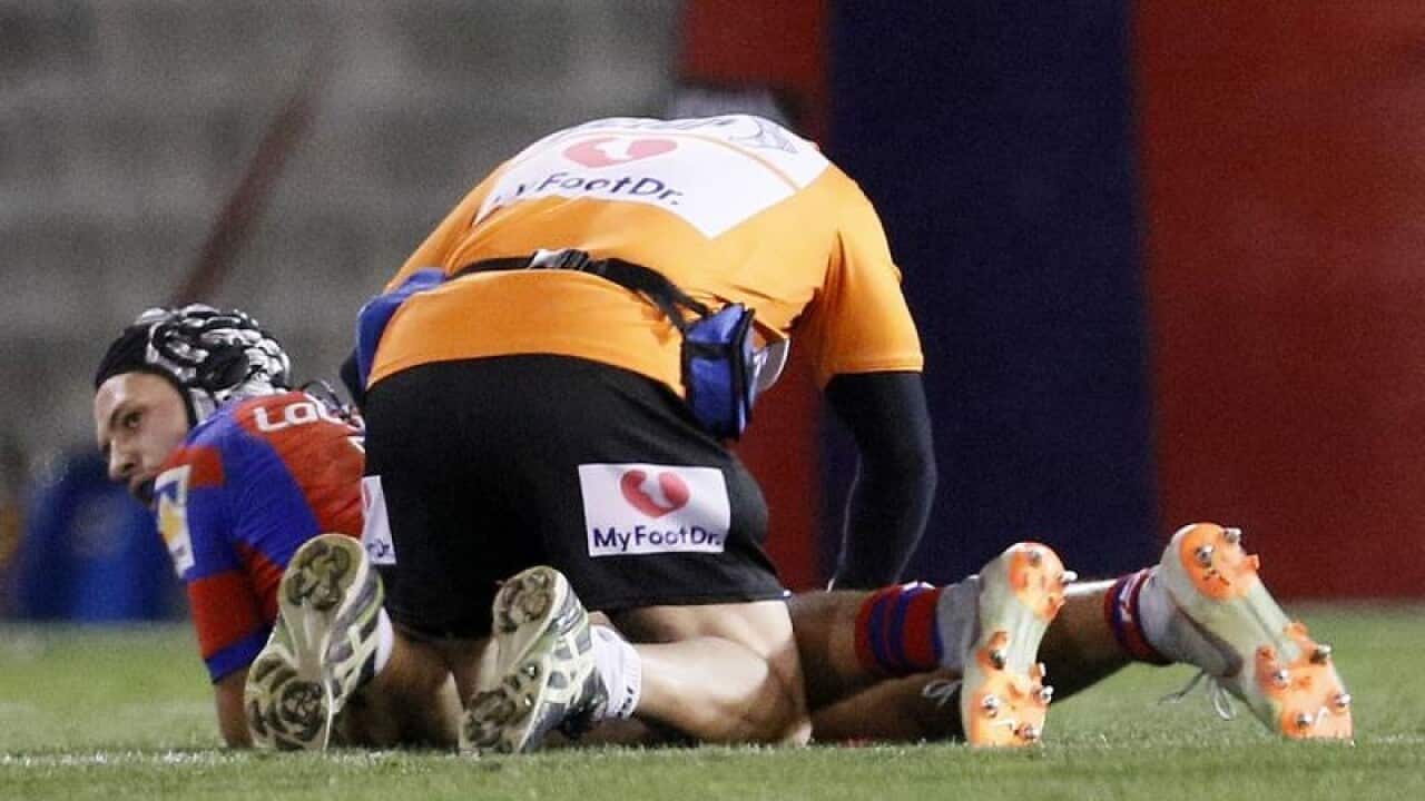 Kalyn Ponga is treated by medical staff