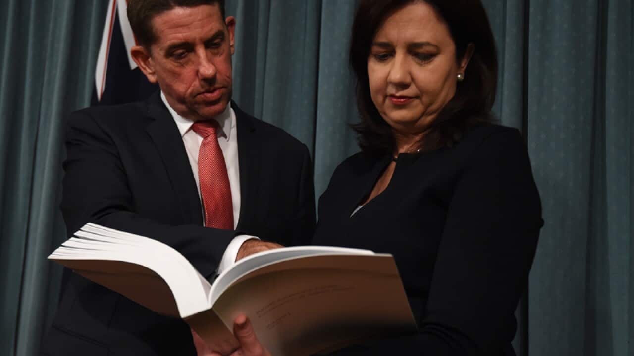 Queensland Premier Annastacia Palaszczuk (r) and Minister Cameron Dick