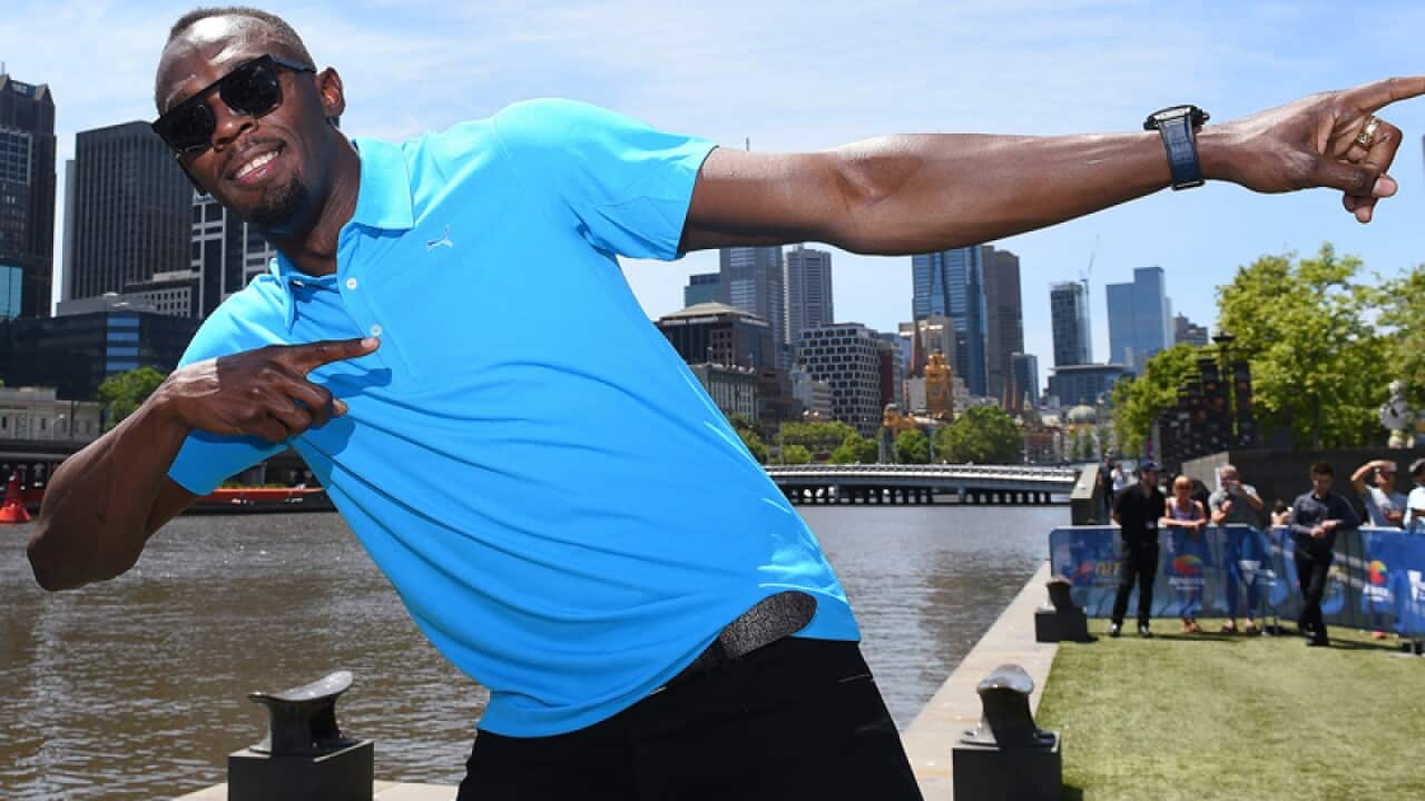 Usain Bolt performs his signature "Bolt" stance