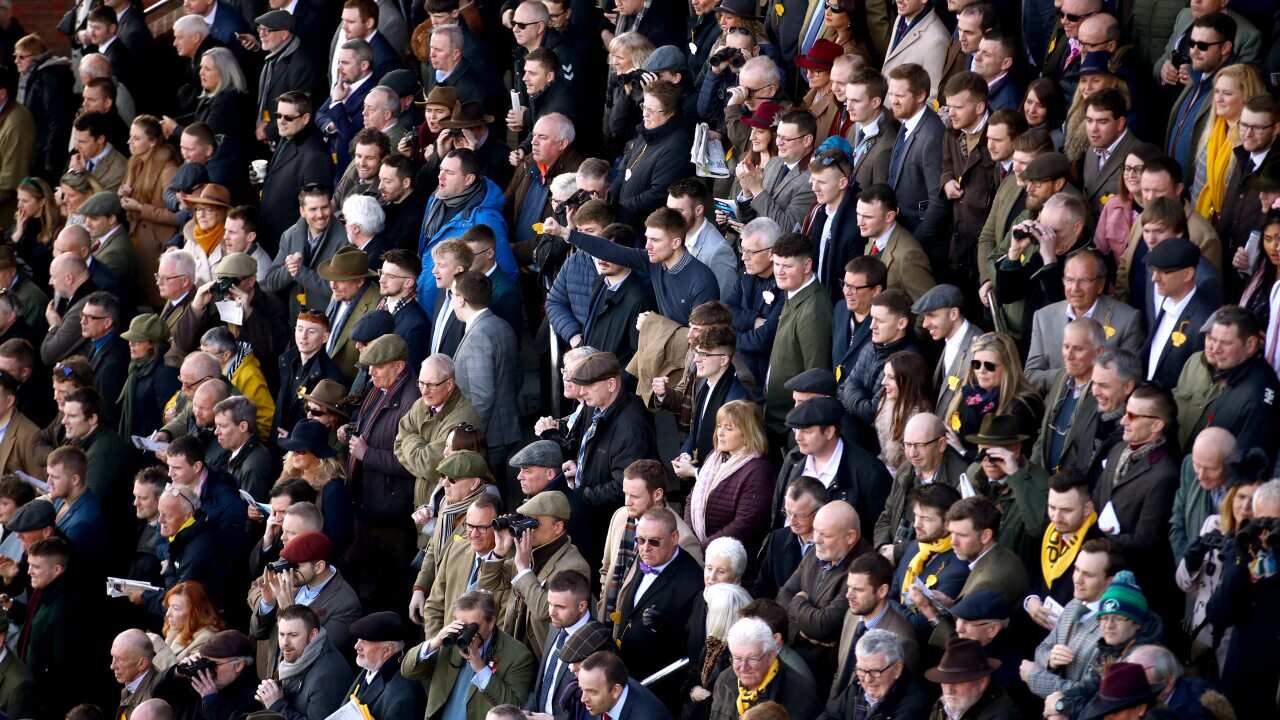 Crowds during day four of the Cheltenham Festival at Cheltenham Racecourse, UK,, 13 March, 2020.