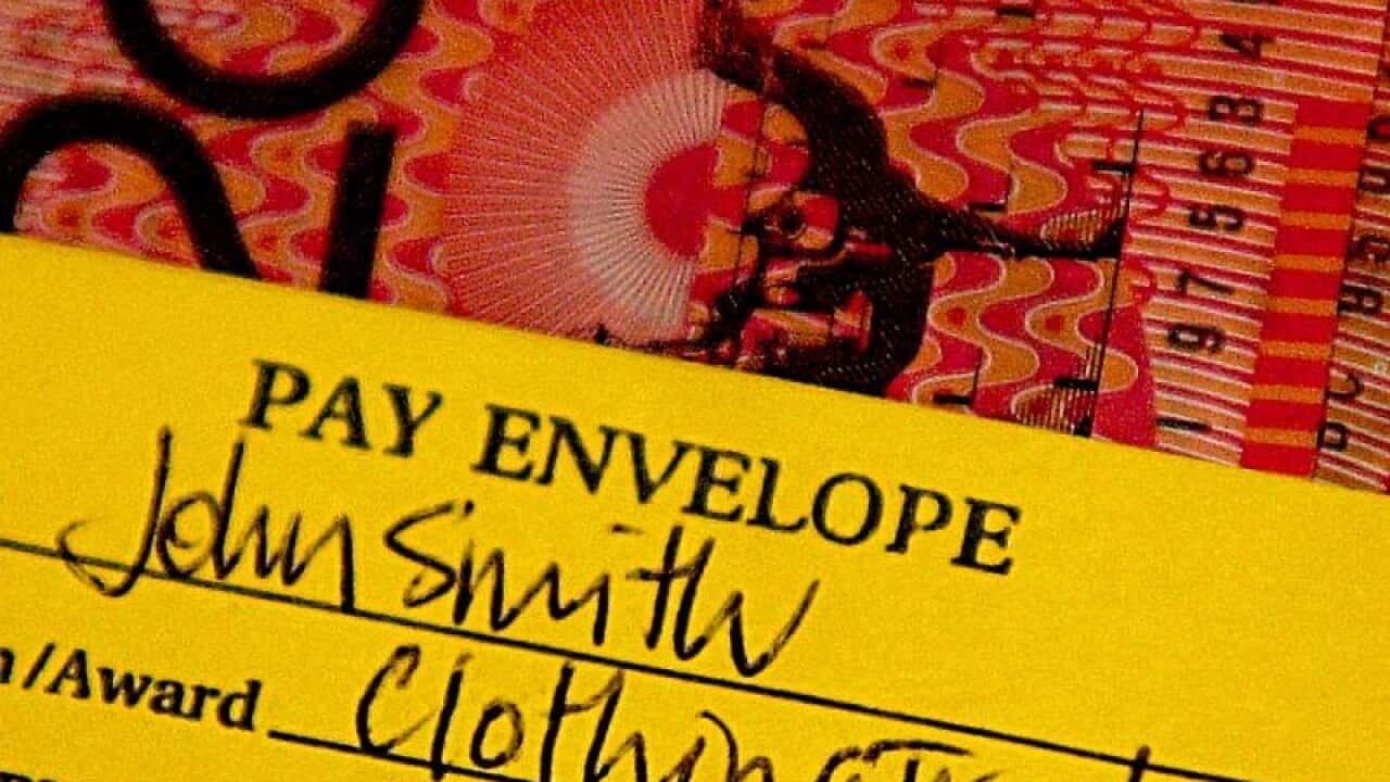 A standard pay packet showing twenty- and fifty-dollar notes.