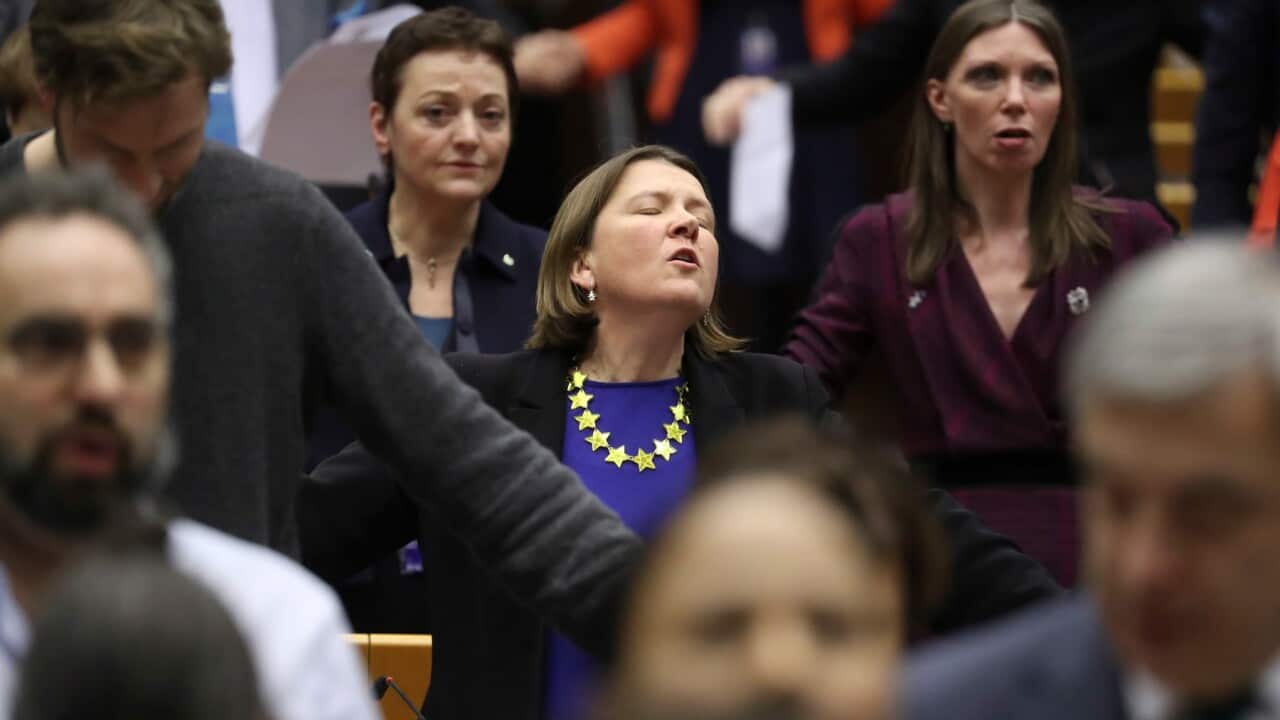 Members of EU Parliament sing Auld Lang Syne during plenary session on BREXIT vote