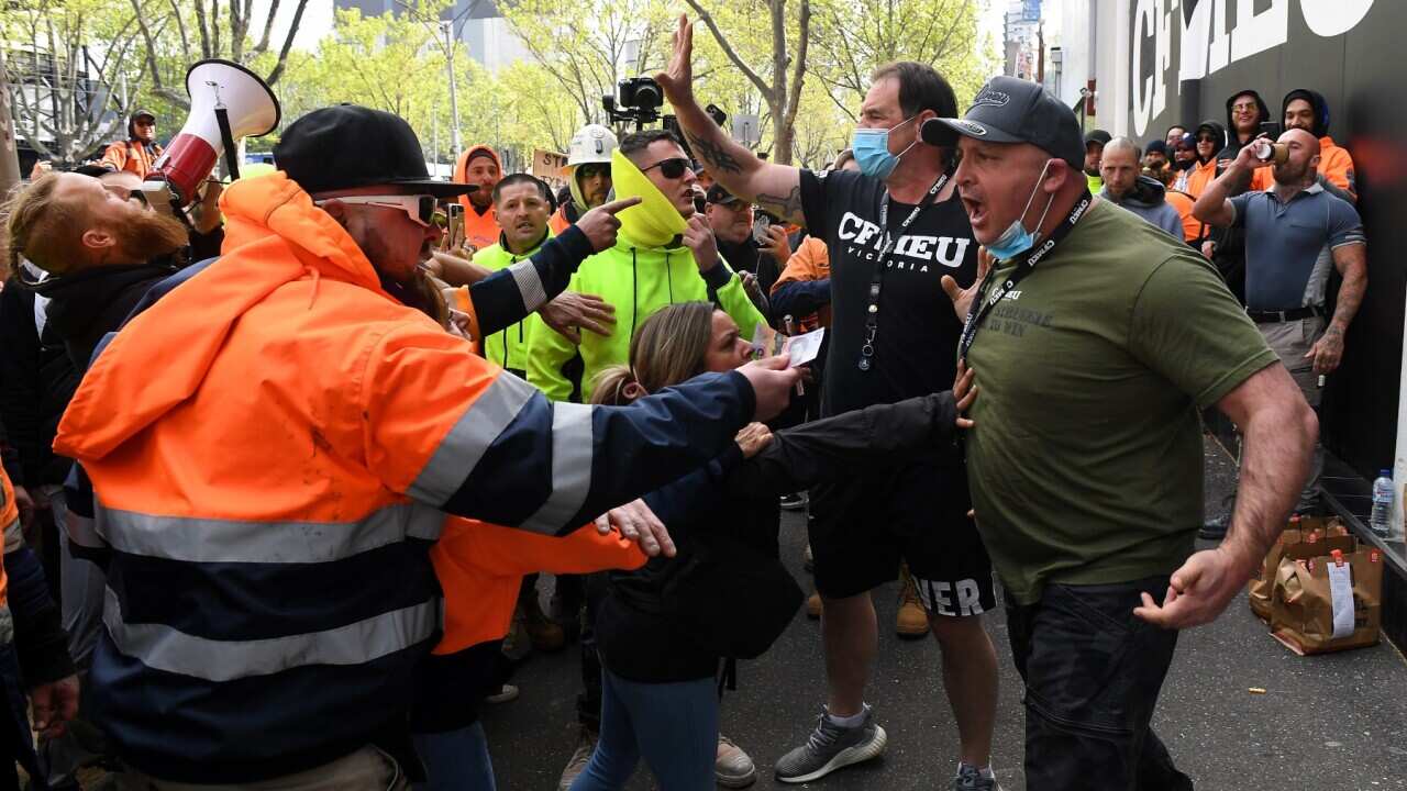 Construction workers clash with unionists at a protest at Construction, Forestry, Maritime, Mining and Energy Union (CFMEU) headquarters in Melbourne