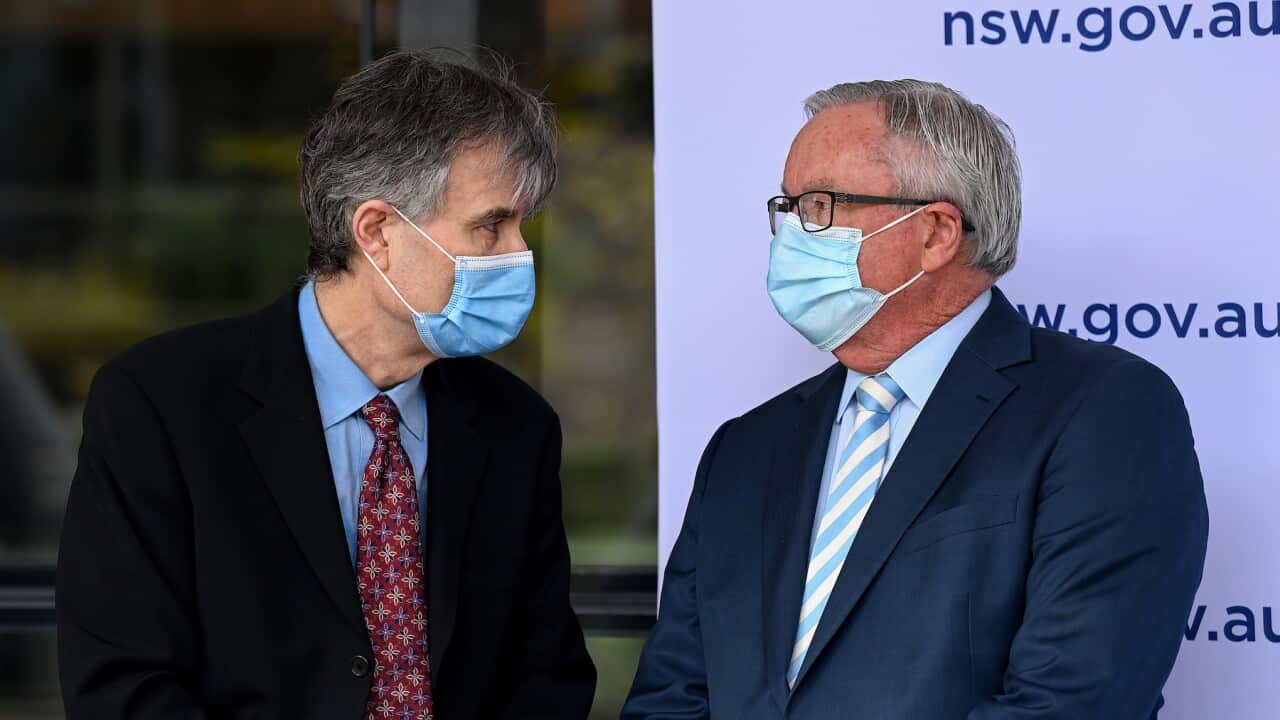 NSW Healths Dr Jeremy McAnulty (left) and NSW Health Minister Brad Hazzard during a COVID-19 press conference in Sydney, Saturday, August 28, 2021.