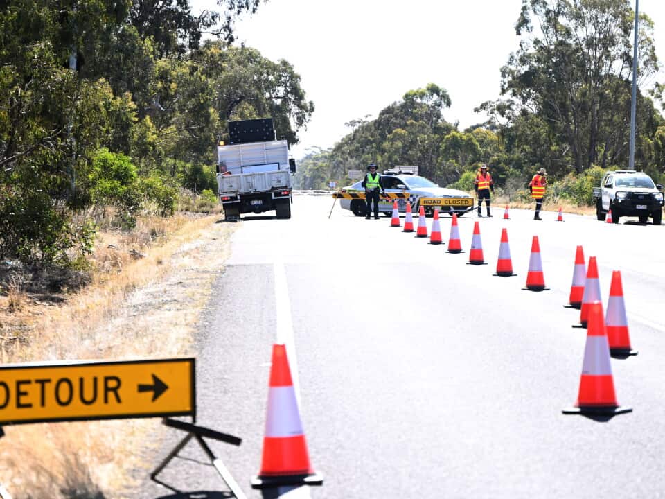 Victoria Police establish a roadblock on the Western Highway approaching Horsham in Victoria, Wednesday, February 14, 2024.