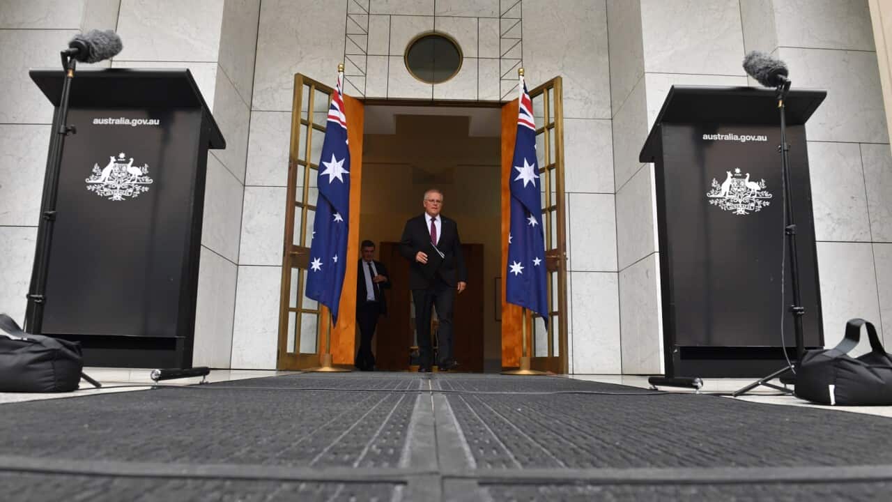 Prime Minister Scott Morrison arrives at a press conference at Parliament House in Canberra