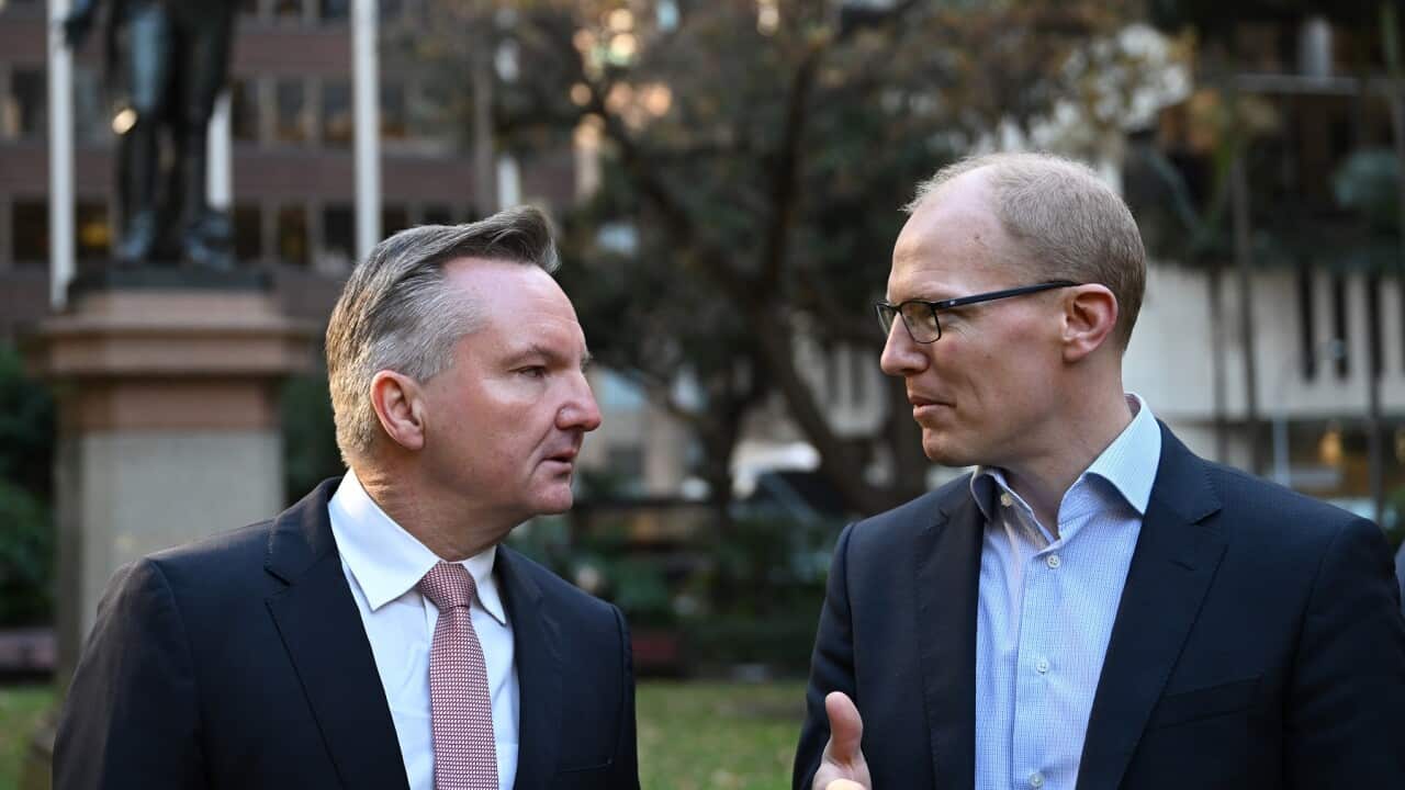 Federal Minister for Climate Change and Energy Chris Bowen (left) chats with AEMO chief executive Daniel Westerman