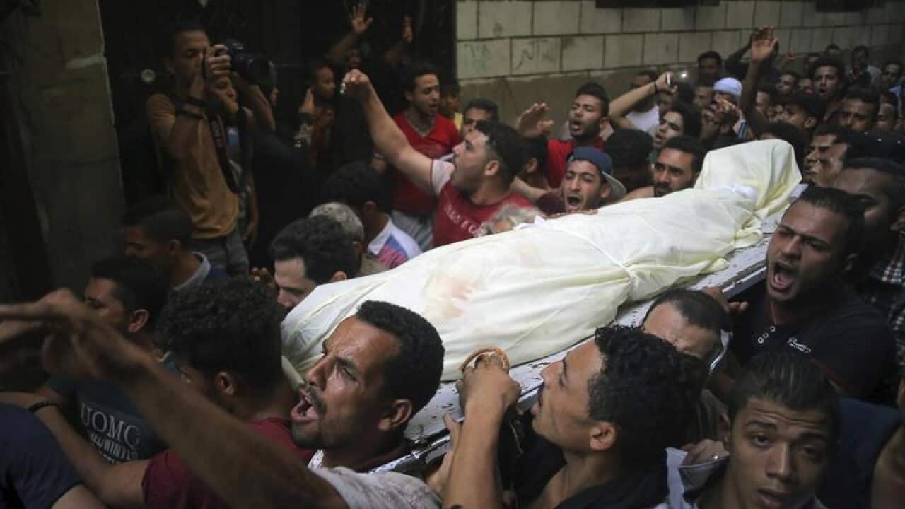 People carry the body of Sayed Tafshan