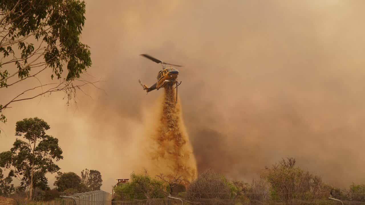 DFES fire fighters battling a bushfire at Wooroloo, north-west of Perth