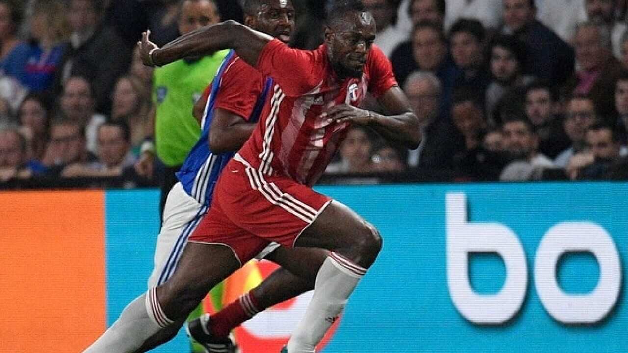 Jamaican athlete Usain Bolt plays in a friendly between French 1998 World Champion soccer players and an international selection in June 2018