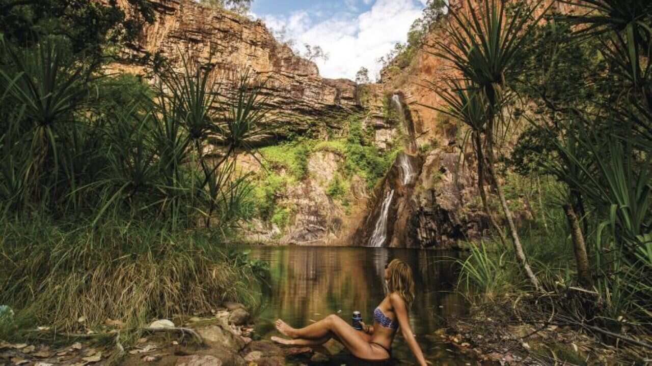 4-Lady_sitting_at_the_edge_of_the_water_at_Sandy_Creek_Falls_Litchfield_National_Park.jpg (1).jpg