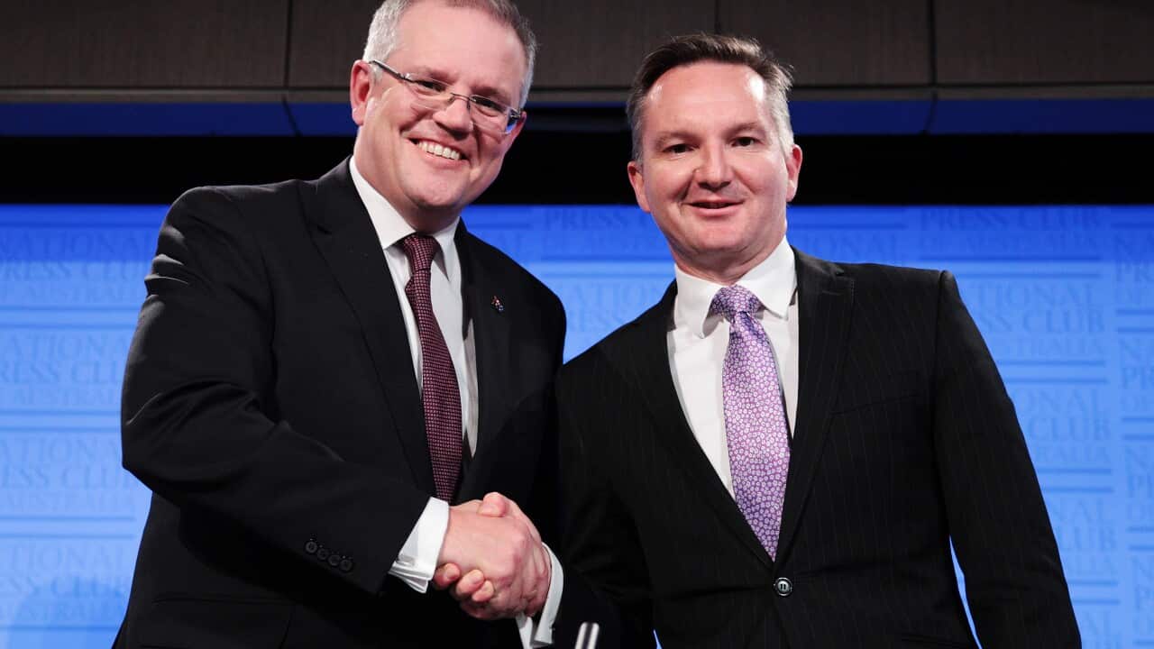 Treasurer Scott Morrison (left) and Shadow Treasurer Chris Bowen shake hands after the Treasurers Debate at the National Press Club in Canberra, Friday, May 27, 2016.