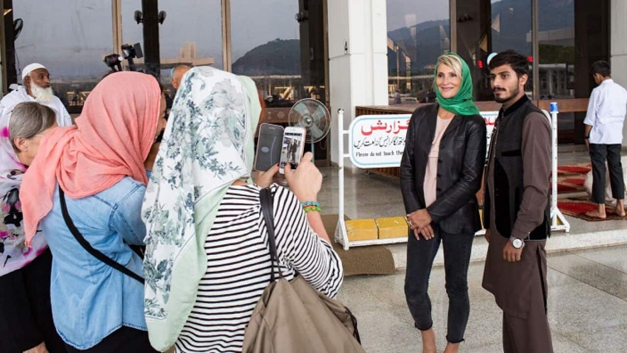 Western tourists take pictures of themselves and their locals in Islamabad.