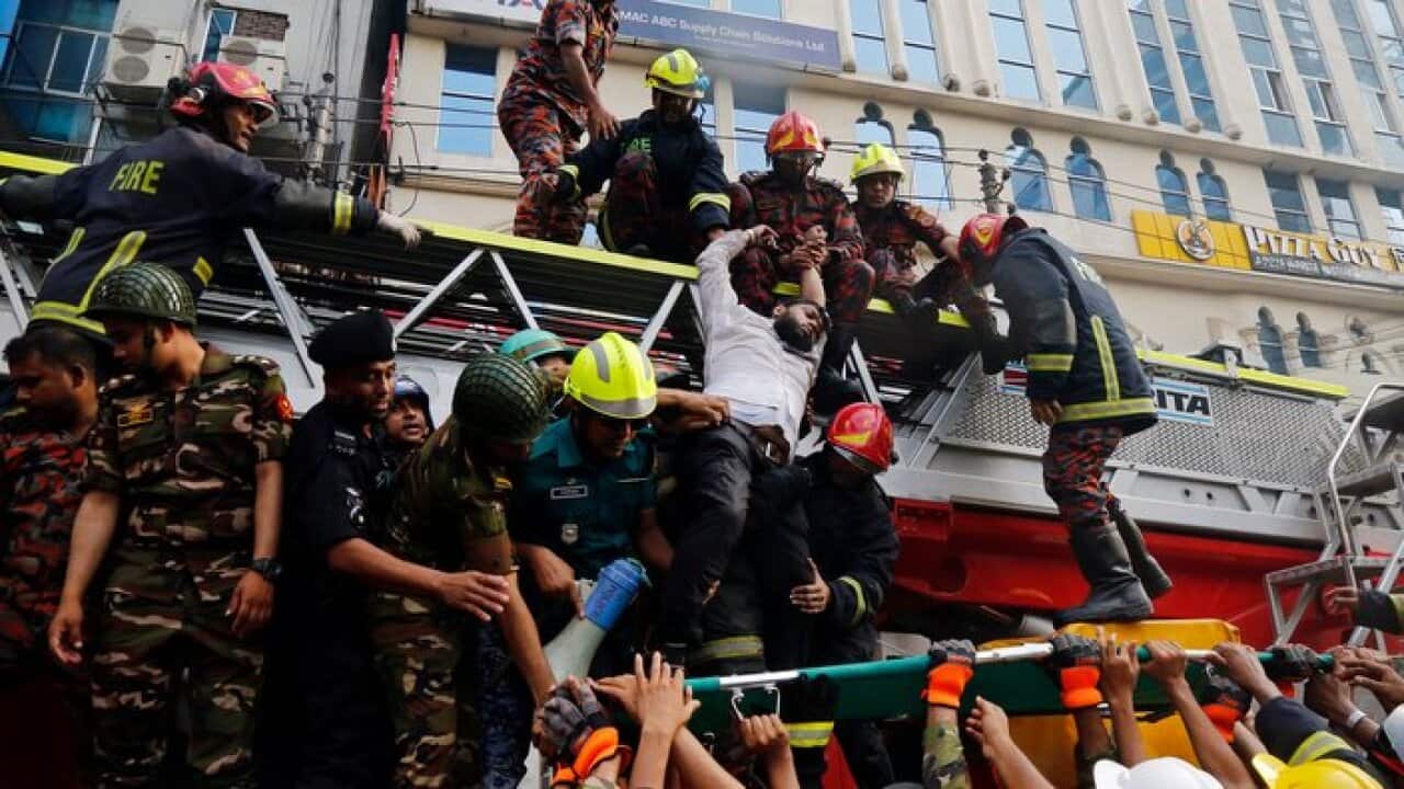 Firefighters rescue people from a burning high-rise building in Banani area of Dhaka, Bangladesh, 28 March 2019.