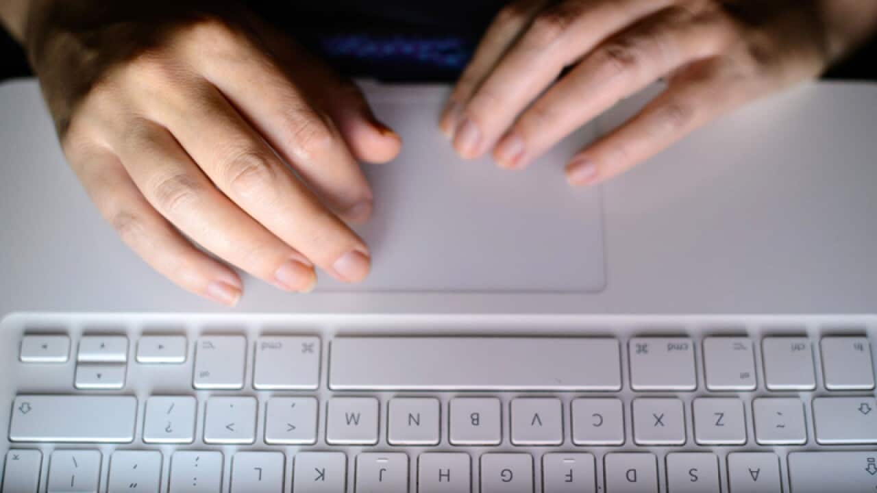 A person uses a laptop computer