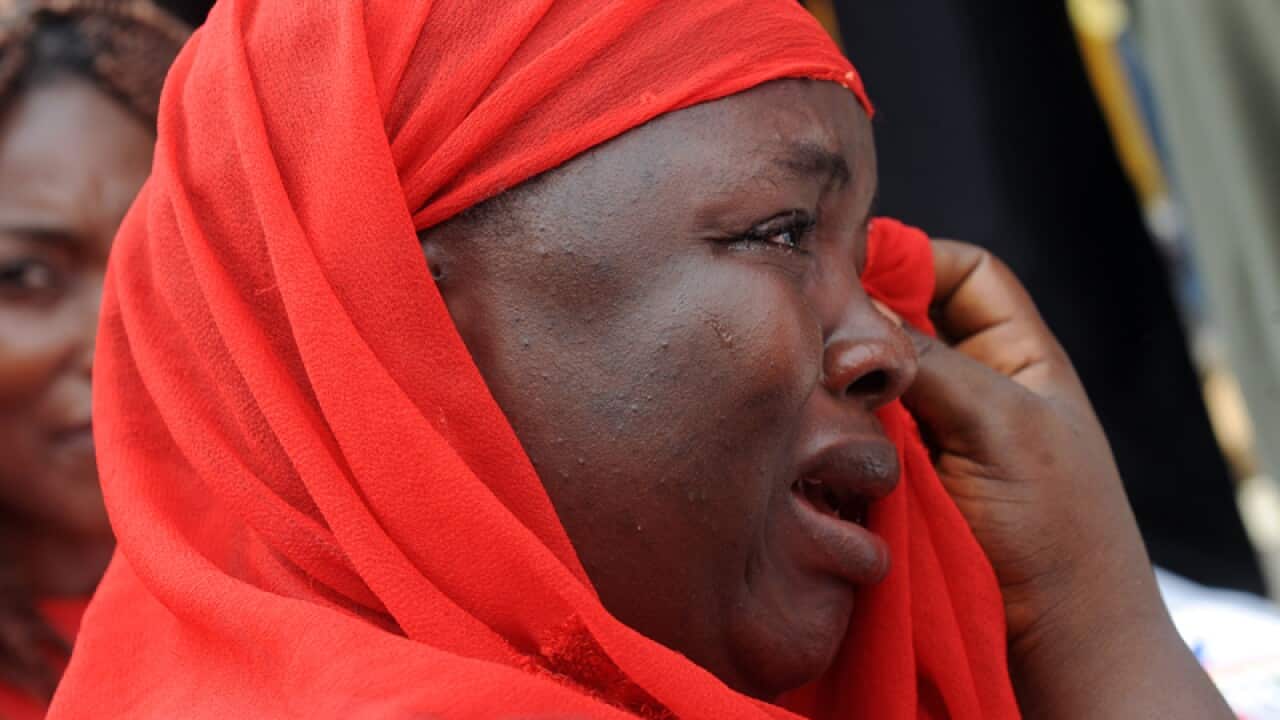 sister of kidnapped school girls Hauwa Ishaya stands outside