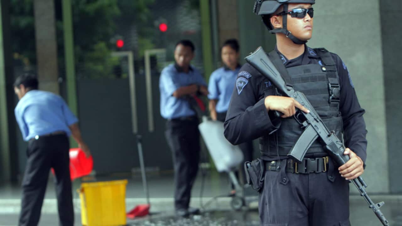 An Indonesian anti-terrorist policeman near the site of attacks