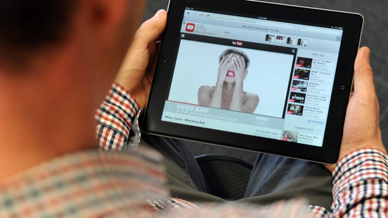 A You Tube user watches a music video on an iPad in Melbourne