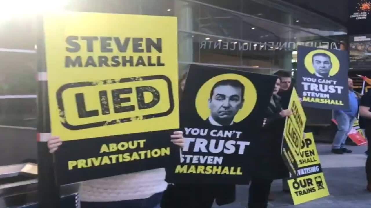 Protesters gather outside the Adelaide Convention Centre to express their displeasure with SA Premier Steven Marshall and Prime Minister Scott Morrison.