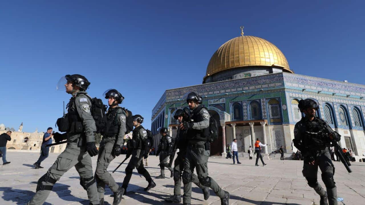 Israeli forces intervene in Palestinians at Al-Aqsa Mosque after Palestinians react to the Israeli raid at Al-Aqsa Mosque in Jerusalem.