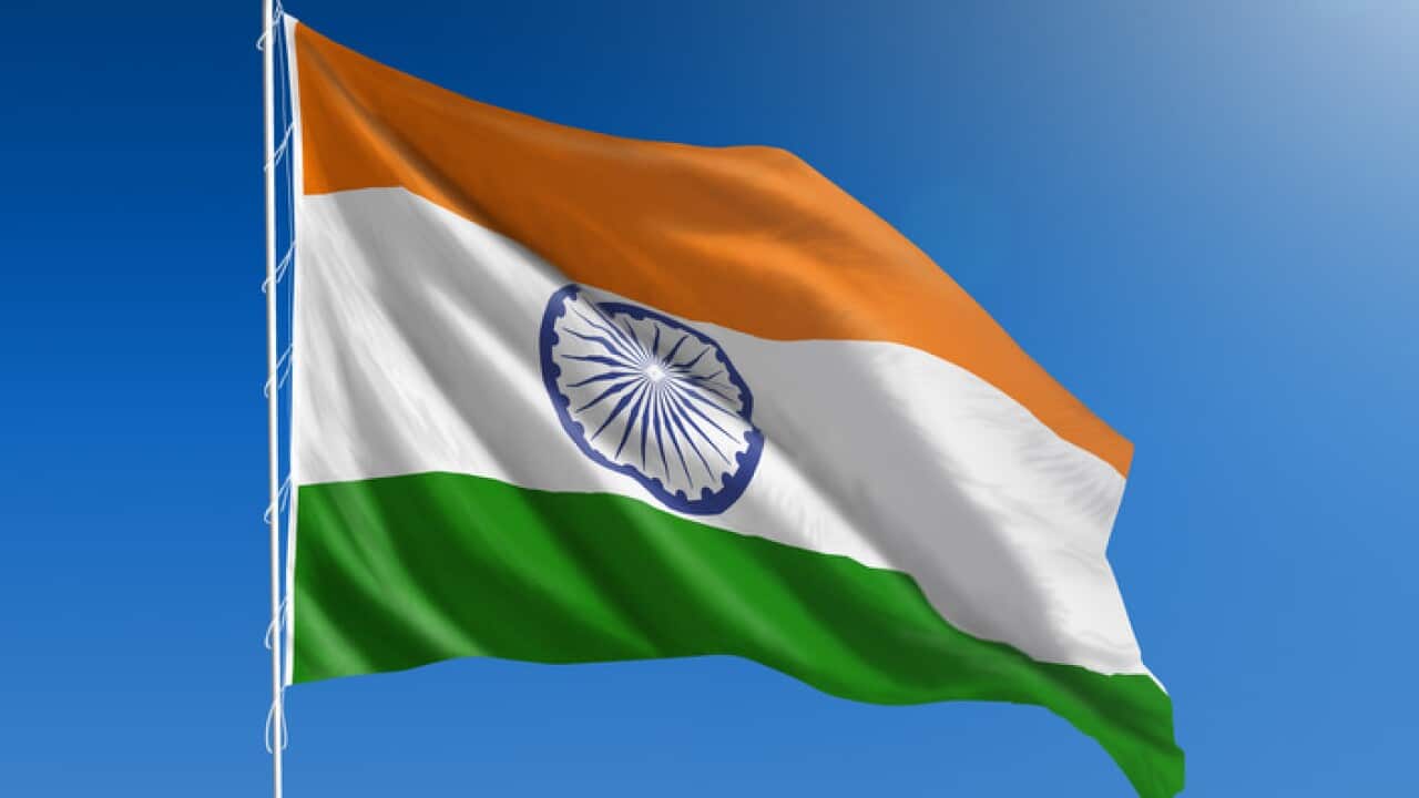 National flag of India on clear blue sky