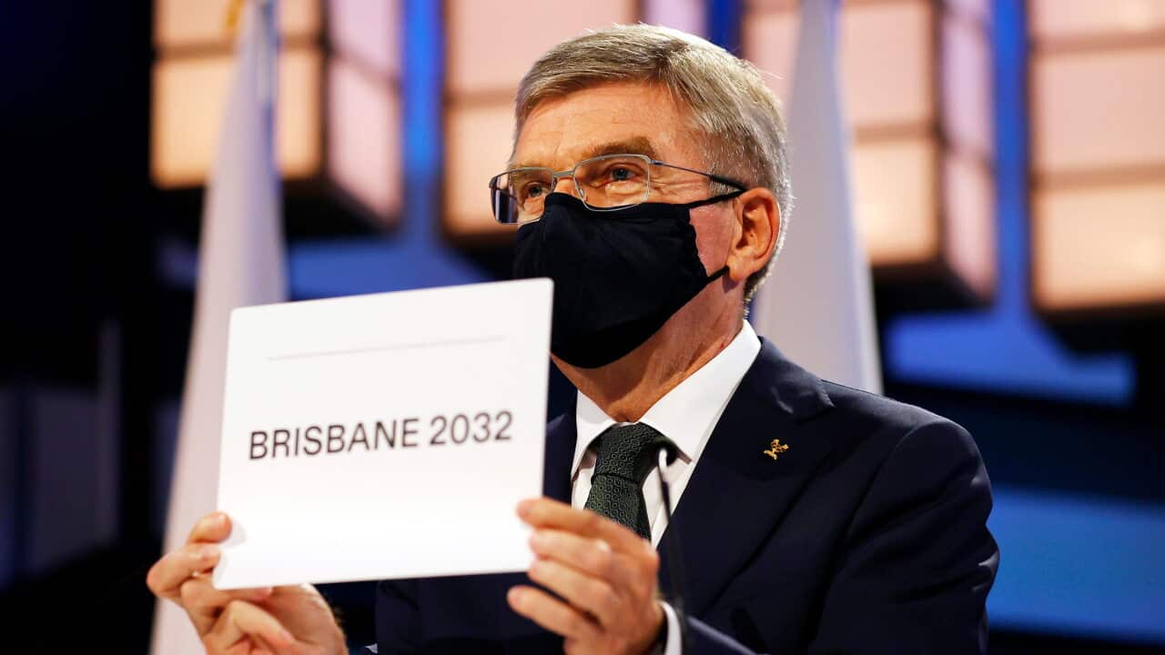 President of the International Olympic Committee Thomas Bach announces Brisbane as the 2032 Summer Olympics host city during the 138th IOC Session at Hotel Okura in Tokyo, Wednesday, July 21, 2021. (Toru Hanai/Pool Photo via AP)
