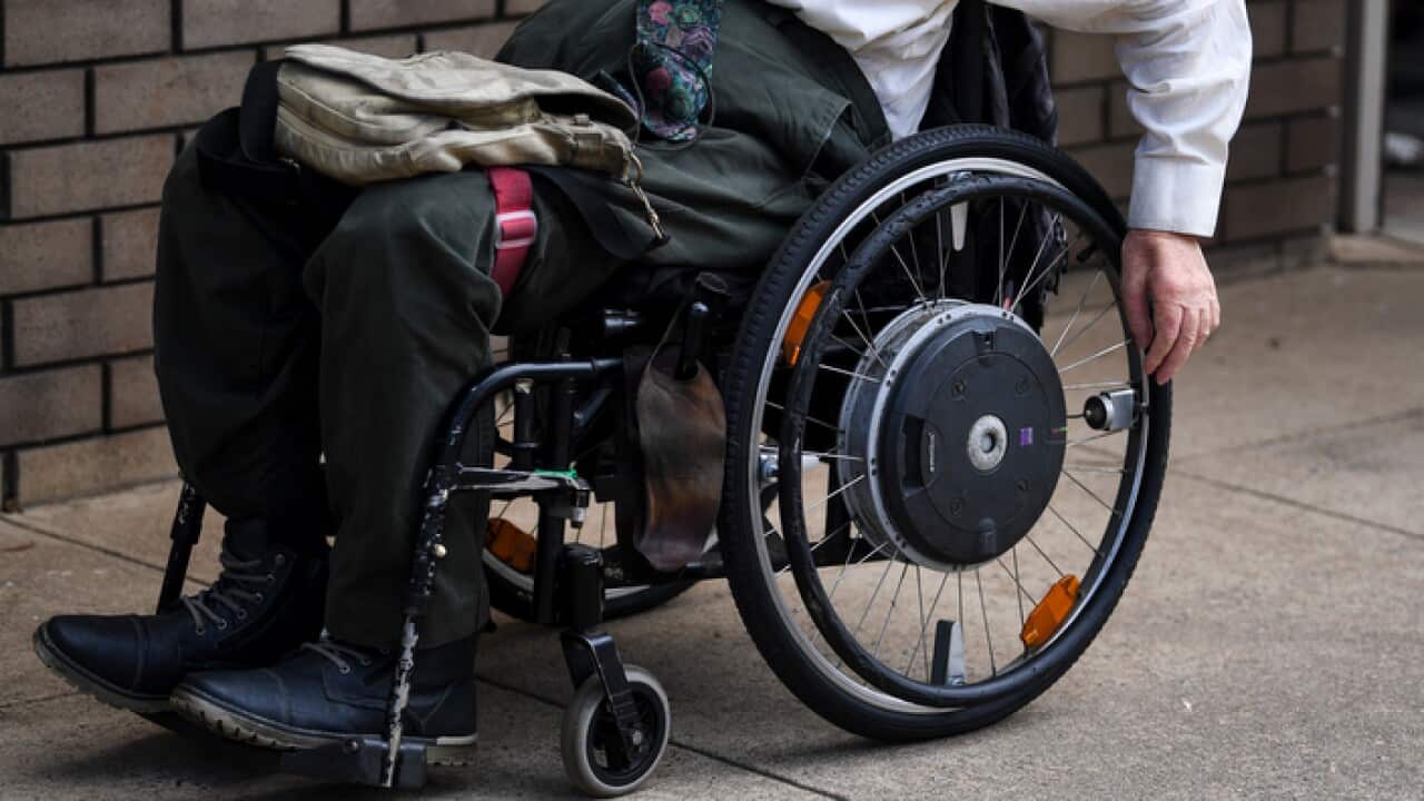 A man in a wheelchair.