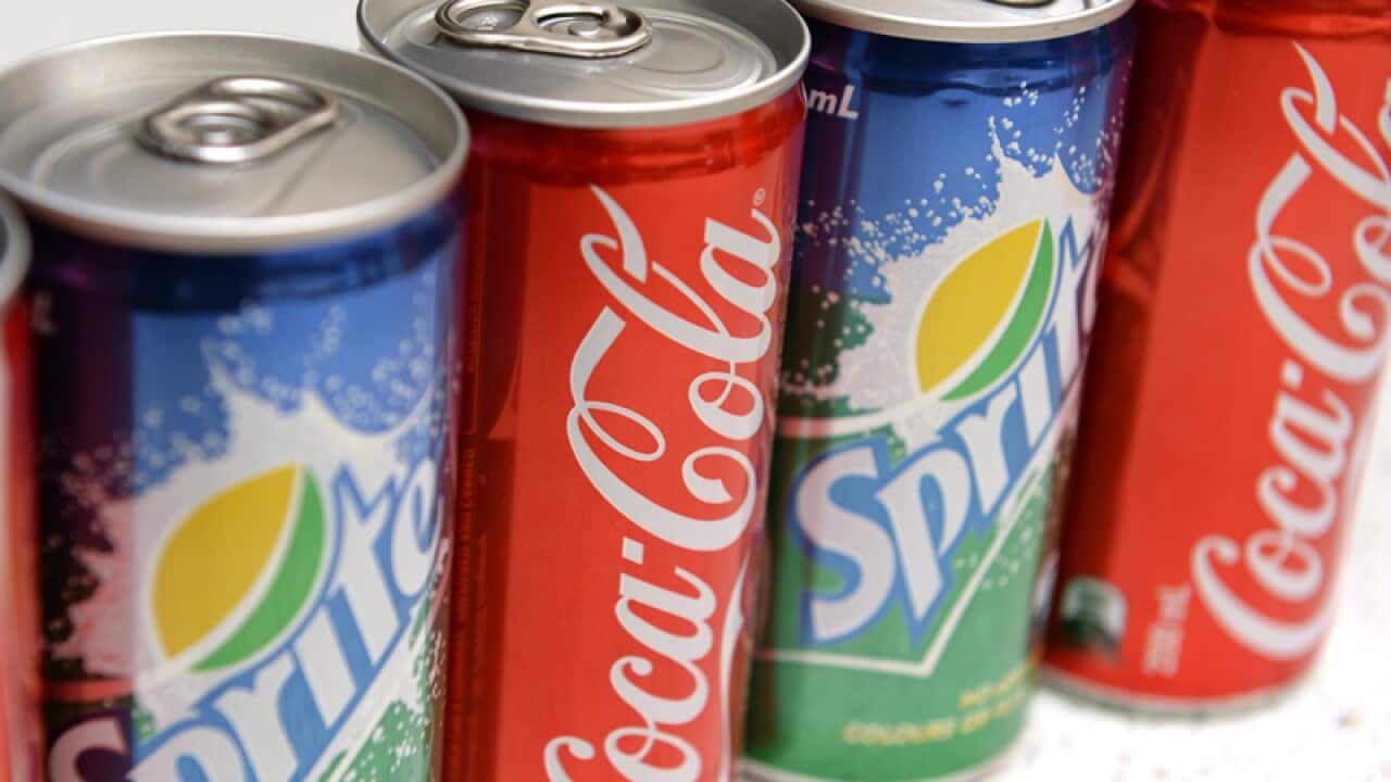 Cans of Sprite and Coca Cola