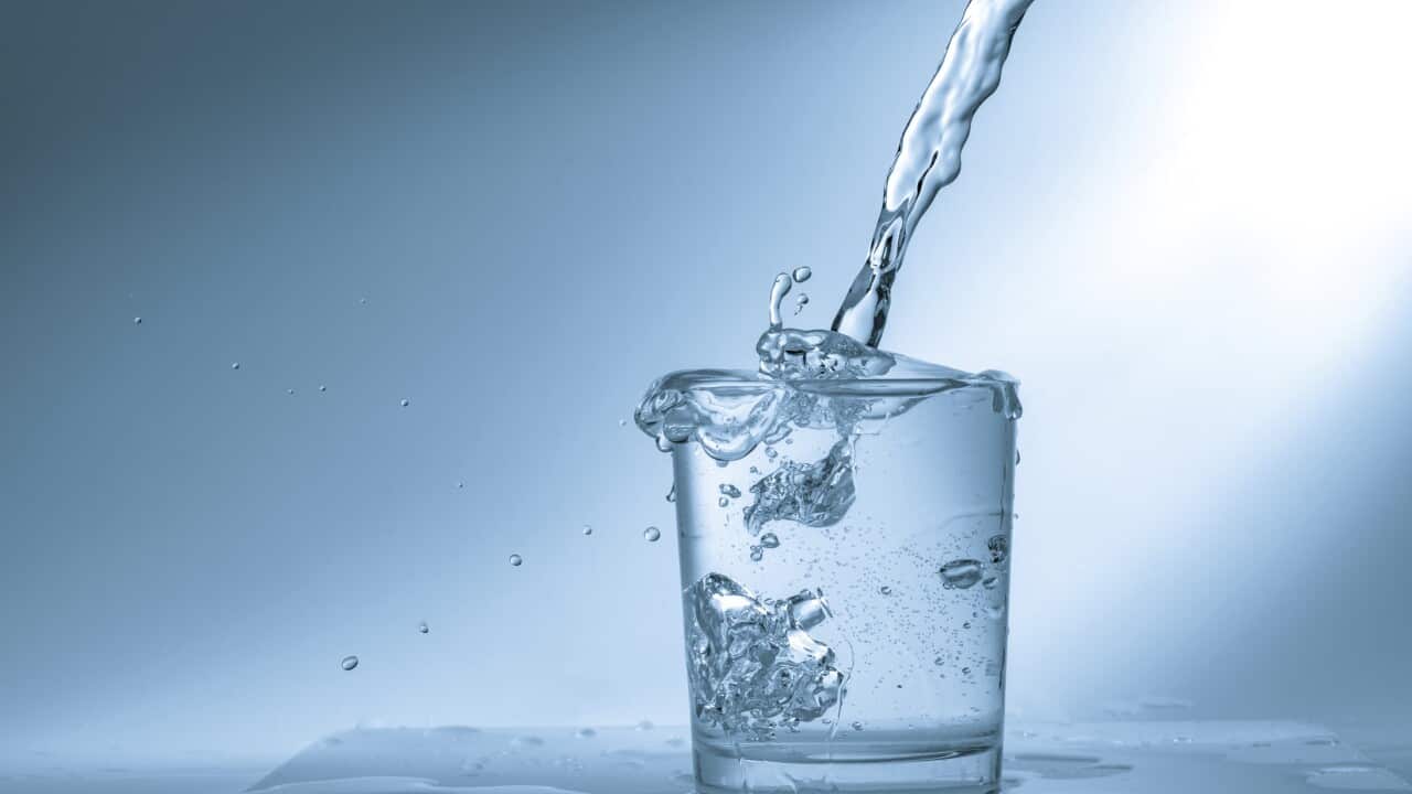 Pouring water into glass