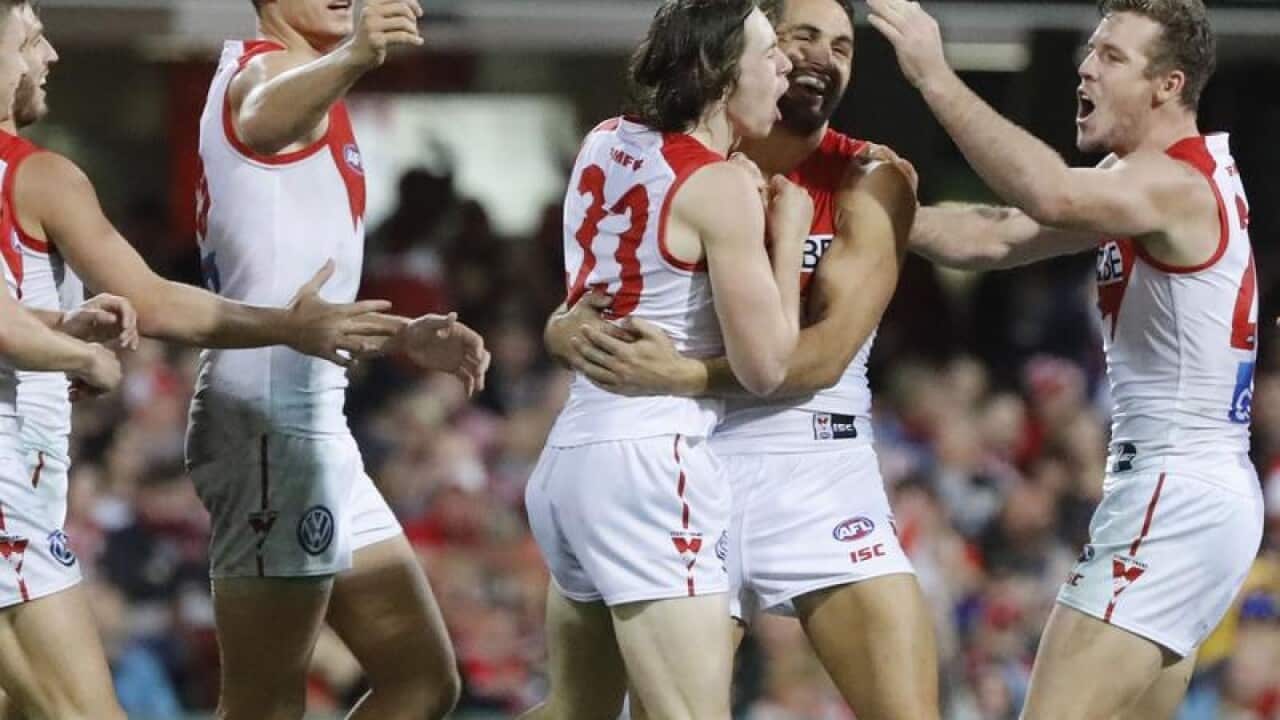 Ryley Stoddart of the Swans celebrates.