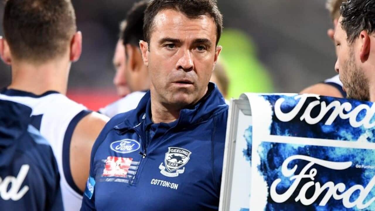 Geelong coach Chris Scott is seen at the break.
