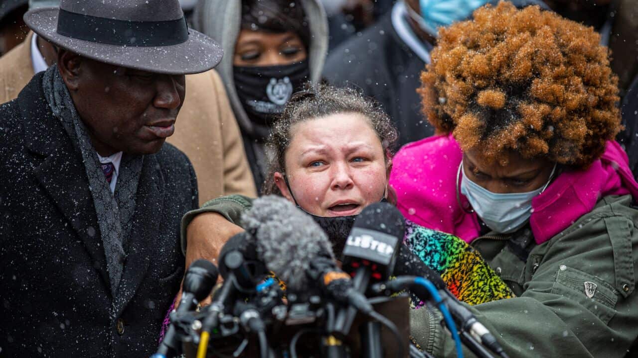 Daunte Wright's mother Katie Wright (C) speaks during press conference at the Hennepin County Government Center in Minneapolis, Minnesota on 13 April.