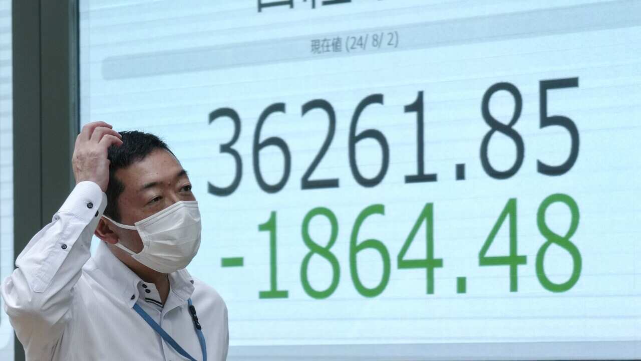 Tokyo stock market average plunges more than 3 percent after the Bank of Japan's interest-rate hike